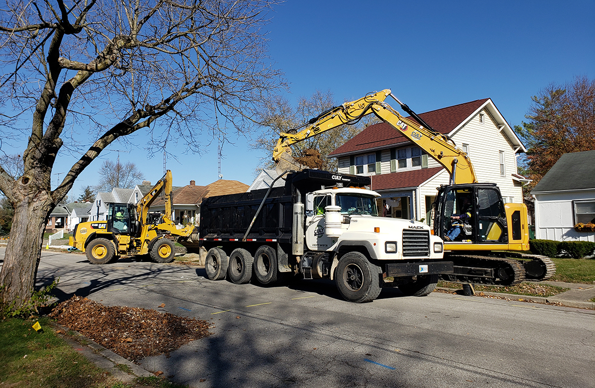 Culy Contracting Trucks working on a public street project